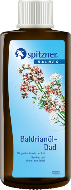 Flacon marron avec bouchon à vis blanc pour bain à l'huile de valériane Balneo d'Spitzner. Étiquette avec logo bleu « Spitzner » et fleurs claires sur fond bleu. Texte : « Bain à l'huile de valériane », « Apaise et favorise le sommeil ».