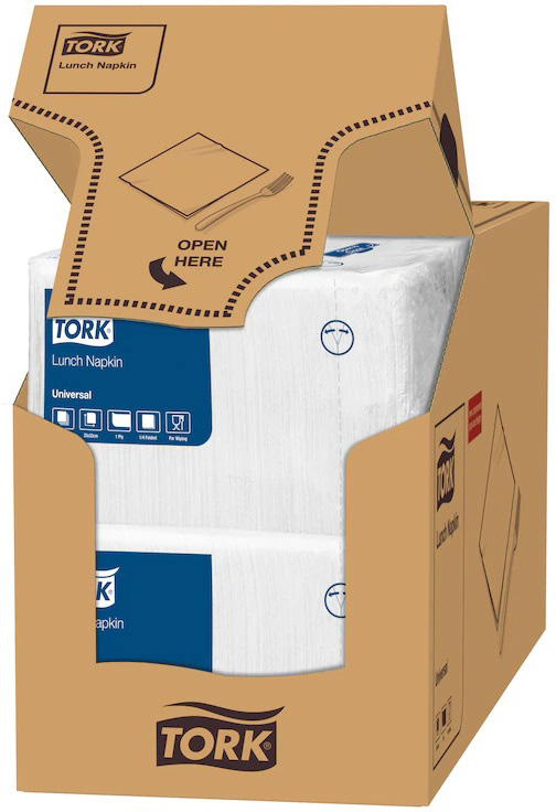 Emballage en carton marron ouvert du distributeur TORK, rempli de serviettes de table blanches à une épaisseur. Le rabat supérieur indique « OPEN HERE » avec symboles de fourchette et serviette. Paquets visibles.