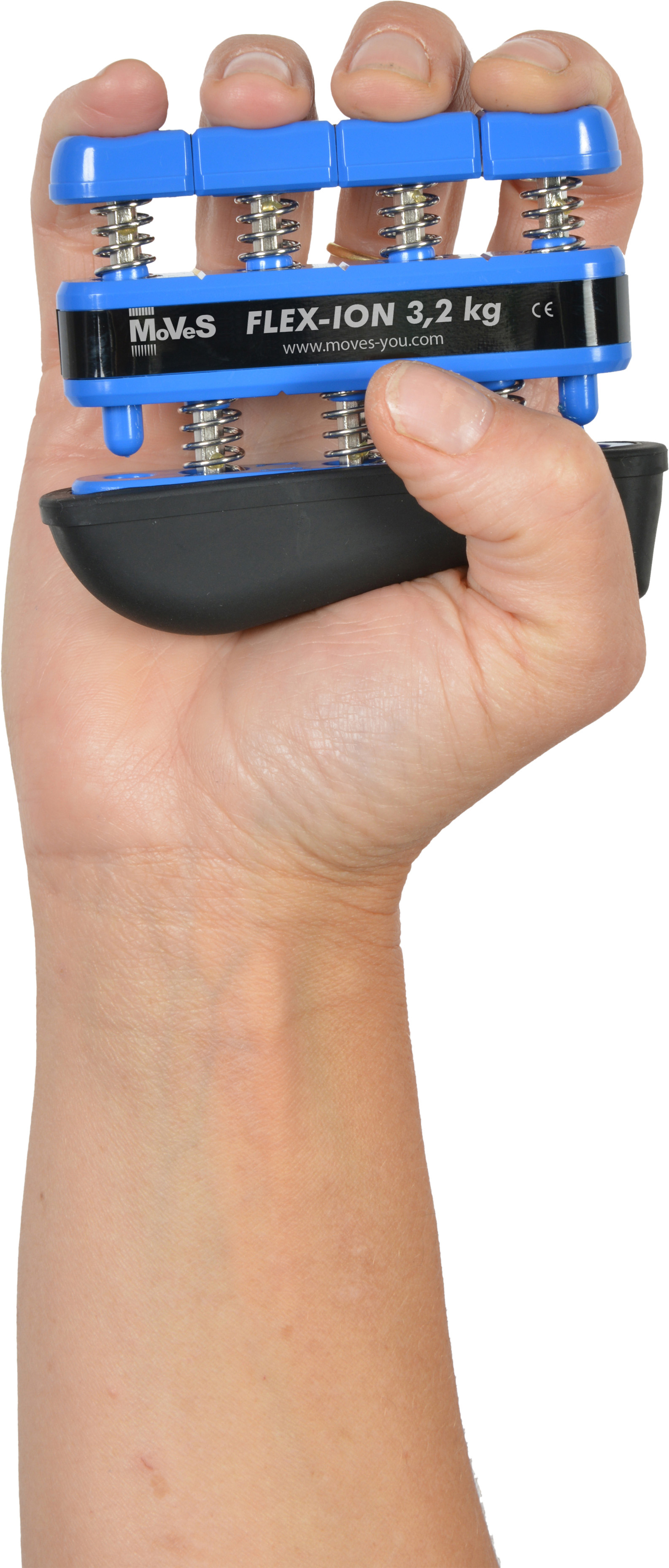 One hand is holding a blue and black Moves Flex-Ion hand trainer. Four fingers are pressing the spring-loaded blue buttons to strengthen the fingers in a controlled manner. The device is labelled ‘FLEX-ION 3.2 kg’.