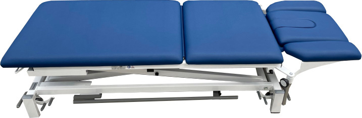 Dark blue, three-section Limburg Basis 3 treatment couch with a sturdy, white metal frame. Headrest with face opening; head and foot sections are adjustable. Height-adjustable, with castors on the feet for ease of movement within practices.