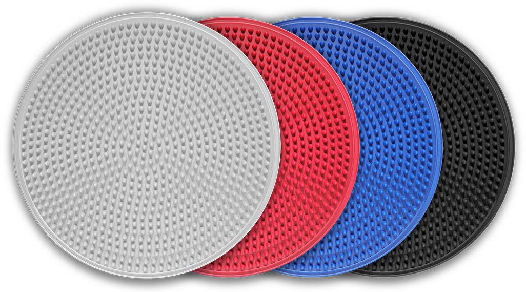 Four textured round balance cushions in grey, red, blue and black, aligned diagonally with grey in front; used for balance, coordination and posture.