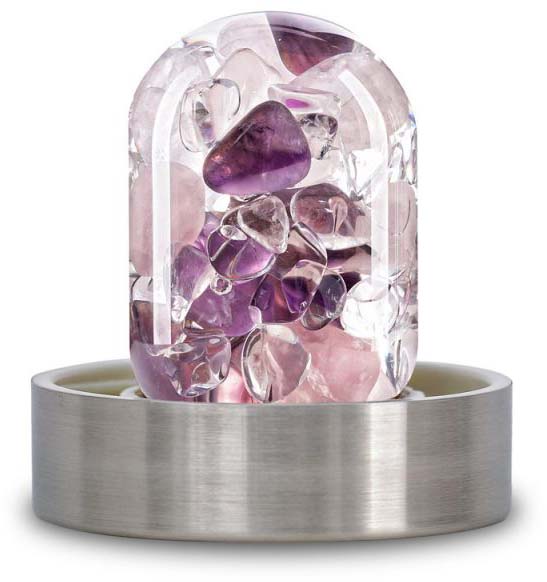 A transparent, elongated glass insert with smoothly cut amethyst, rose quartz and rock crystal gemstones in shades of violet, rose and clear. Fitted with a brushed, silver-coloured metal ring at the base for bottle attachment.