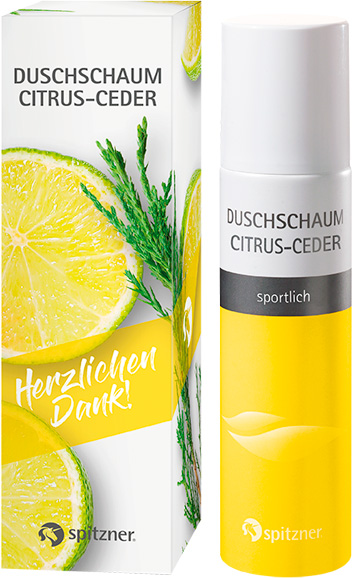 Emballage blanc et flacon jaune de mousse de douche Spitzner Citron-Cèdre, décor citron/cèdre, texte « Merci beaucoup ! », bouchon blanc.