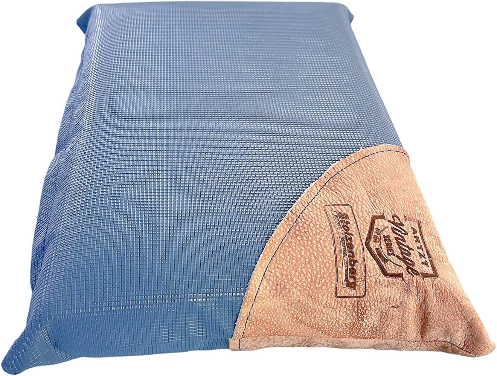 A blue, rectangular massage headrest with a fine mesh texture, ideal for physiotherapy and massage. Light brown, grained faux leather patch featuring the ‘ Stolzenberg ’ logo and ‘ARZT Vintage Series’. Comfortable, promotes a relaxed posture.