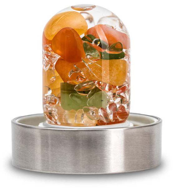 Transparent gemstone insert for water bottles, filled with polished gemstones in orange, clear and green. Glass vial at the base set in a brushed metal ring for secure attachment to the bottle. Energises drinking water.