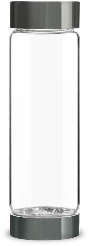 Slim, cylindrical ViA water bottle of clear borosilicate glass, designed to stand upright. Dark grey metallic screw cap and matching metal base. Empty, emphasising transparency and function without gemstones.
