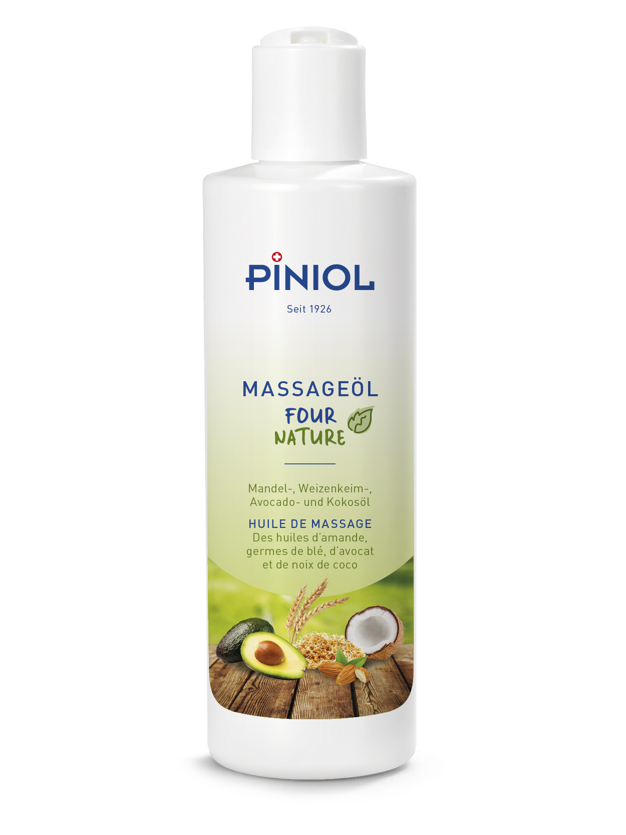 Piniol ’s “Four Nature” massage oil in a white bottle against a light background. The label depicts ingredients such as almonds, ears of wheat, avocado and coconut on a wooden background. Intensively nourishing for the skin, with good glide.