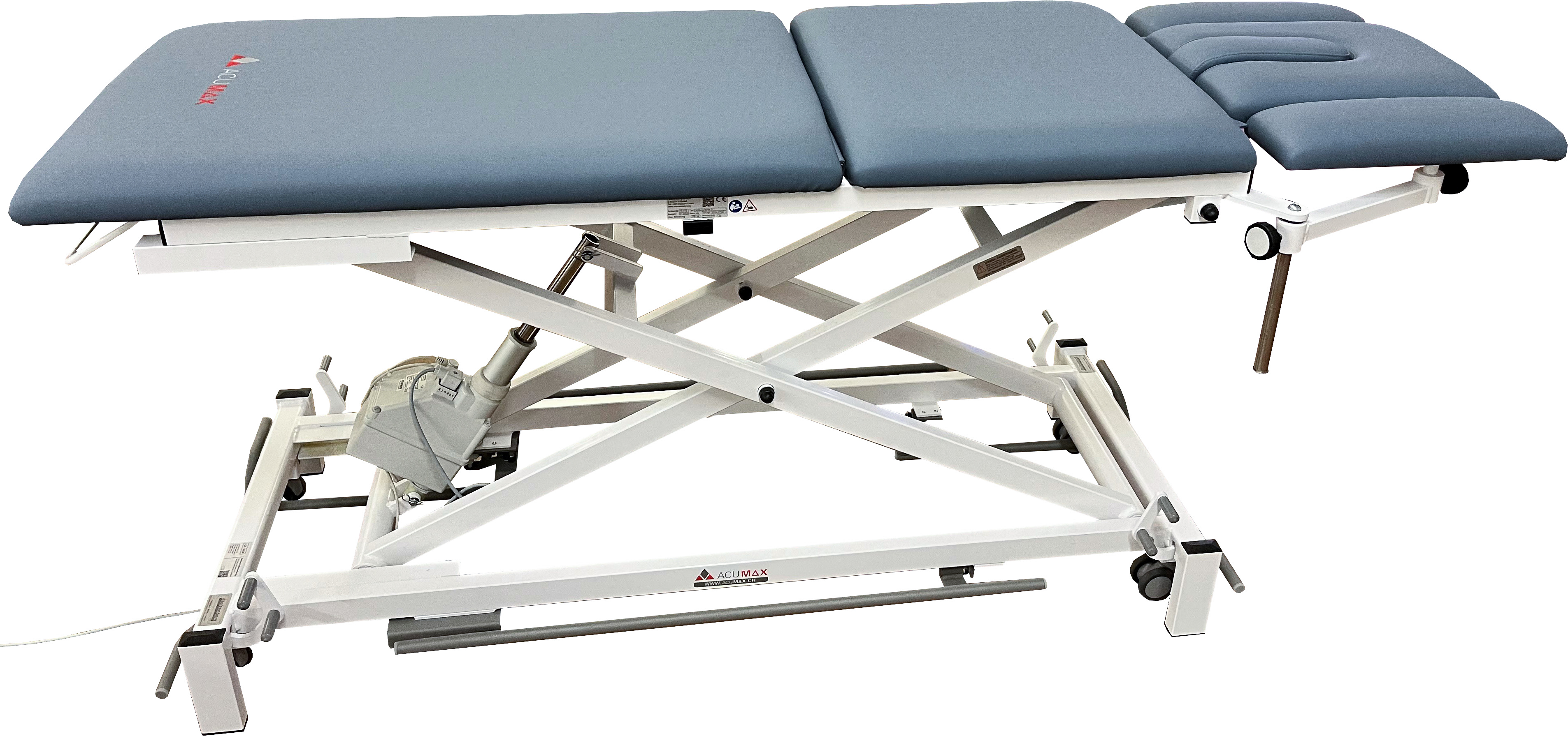 Modern, electrically adjustable treatment couch with three-piece grey-blue upholstery and a sturdy white metal frame. Scissor-lift mechanism for height adjustment, headrest with face cut-out, and castors for easy manoeuvring.